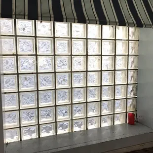 a window with a striped awning