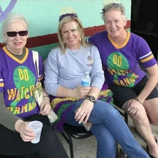 three women sitting on a bench
