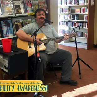 Live entertainment provided by a client during Disability Awareness Month festivities.