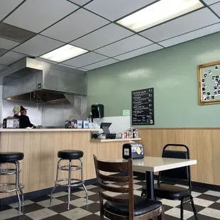 a restaurant with a checkered floor