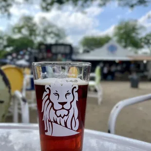 a glass of beer on a table