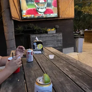 two people sitting at a picnic table