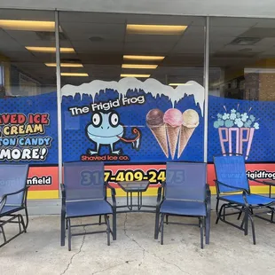 tables and chairs in front of a store