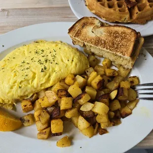 Mushroom and cheese omlete, home fries, toast.