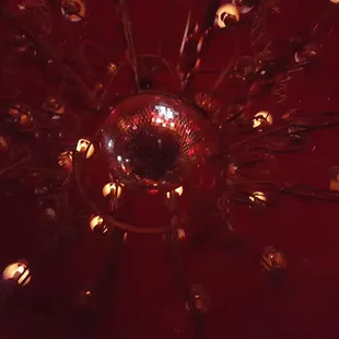 a disco ball surrounded by candles