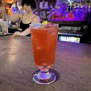 a woman sitting at a bar