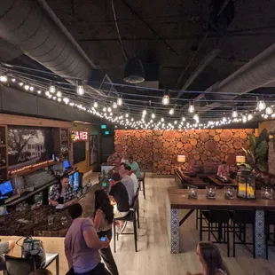 people sitting at tables in a restaurant