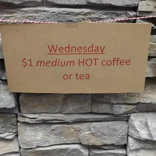 a sign that reads wednesday $ 1 medium hot coffee or tea