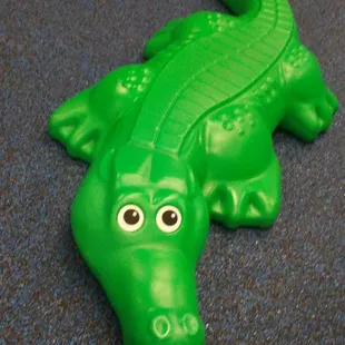 a green plastic alligator