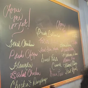 a menu on a chalk board