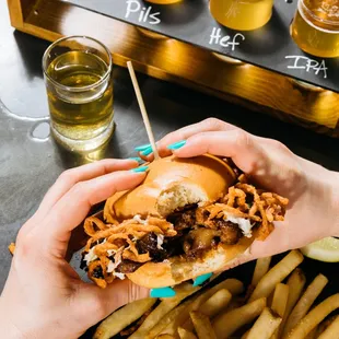 Couldn&apos;t wait to take a bite out of this brisket sandwich. Brisket, fried onions and coleslaw!