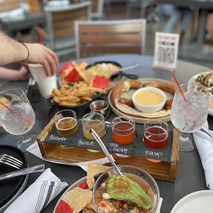 Berry white flight  Pretzel and cheese Mac and cheese with a side of fries  Chicharon nachos  Corn plate