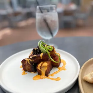 a plate of food and a glass of water