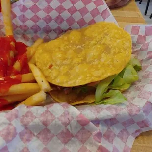 a basket of fries and a cheeseburger