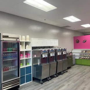 a row of refrigerators in a store