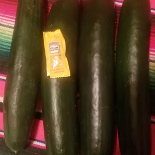 Humongous cukes! Mustard packet for size.