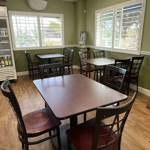 a dining room with tables and chairs