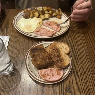 Ham and over medium eggs with country potatoes with no onions or bell peppers and wheat toast and coffee.