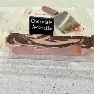 a piece of chocolate with a sign on it