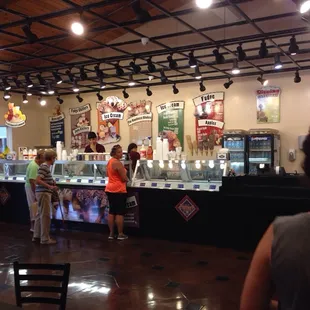 a group of people standing in front of a counter