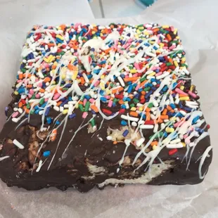 Chocolate covered rice crispy treat covered in sprinkles, yummmmm.