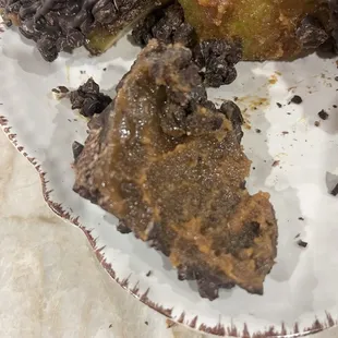 More crystallized caramel, texture of gritty, soupy peanut butter.