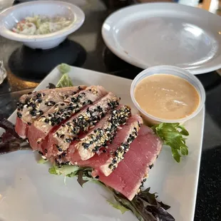 Seared ahi tuna with a wasabi sauce.