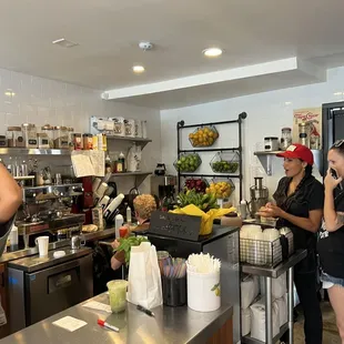 a group of people in a kitchen