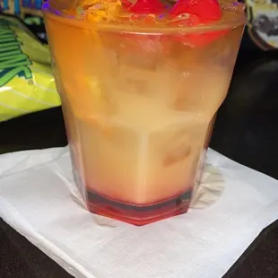 a drink in a glass on a napkin