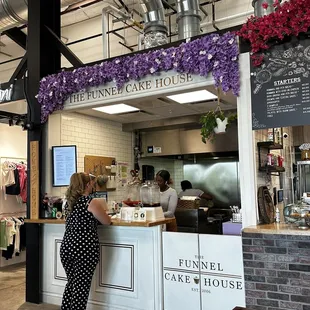 a woman standing at the counter