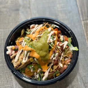 with vegan chicken asada with the umami noodles, fusion rice, potatoes, veggies, and all the toppings.