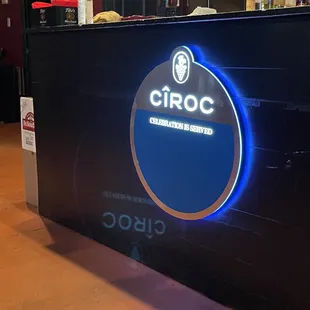 a bar with a neon sign