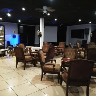 a large room with chairs and tables