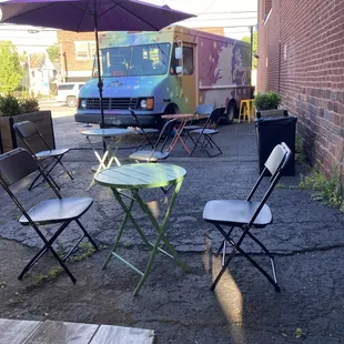 Outdoor seating area behind The Galaxy Coffee truck