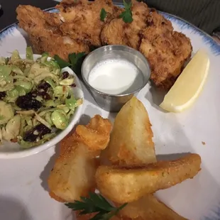 Buttermilk fried whitefish with Brussels sprout coleslaw and potato wedges.