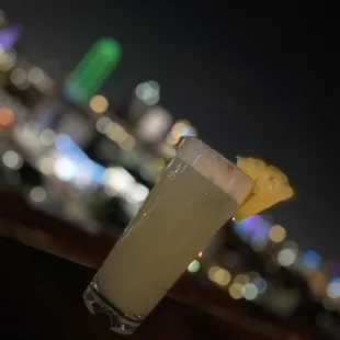 a cocktail with a pineapple garnish