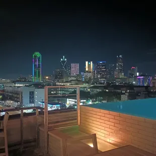 Dallas night skyline from the rooftop pool and bar.