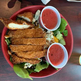 Garden salad with pecan encrusted chicken.