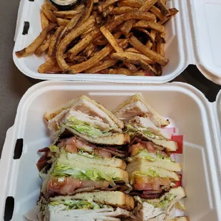 Club sandwich on white with fries