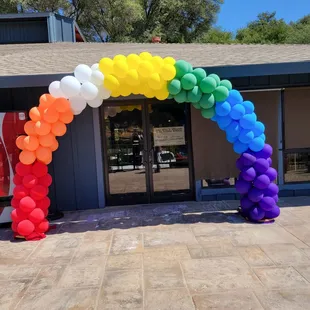 a colorful arch of balloons