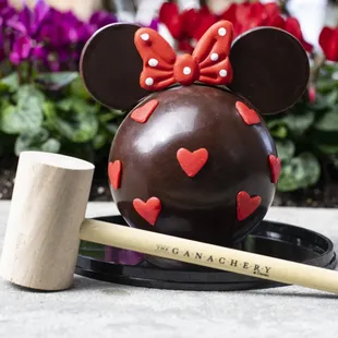 a chocolate mouse with red hearts on it