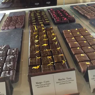 House-made ganaches. Available for purchase by the piece of in boxes of 6, 9 or 12.