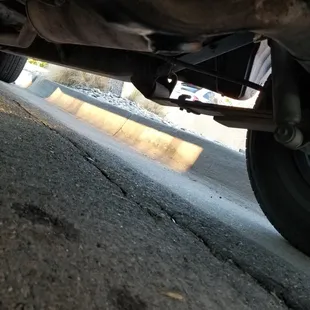 Stains under the car, on the road, where it never dripped/left stains before