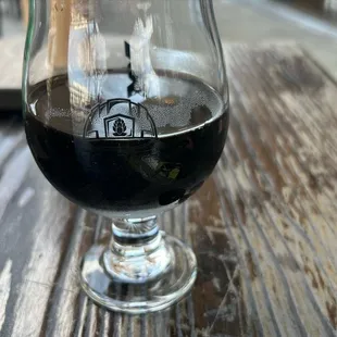 a glass of beer on a table