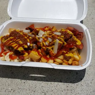 Traditional trash plate with hot dog.