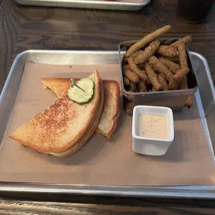 a sandwich and fries on a tray
