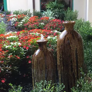 Garden with fountains with Windows on all four sides for guests to enjoy while the dine.