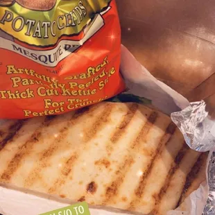 a bag of chips and a sandwich