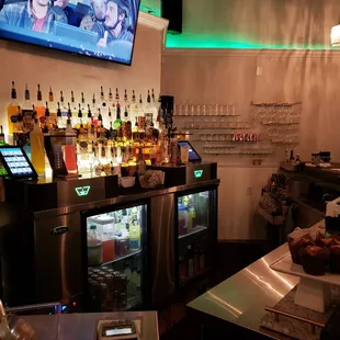 a bar with a television on the wall