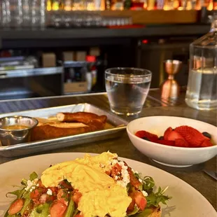 Avocado Toast with egg, pretzel and side of fruit, Yum!!